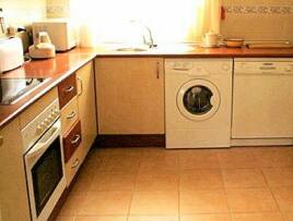 modern kitchen with dish washer and tumble dryer